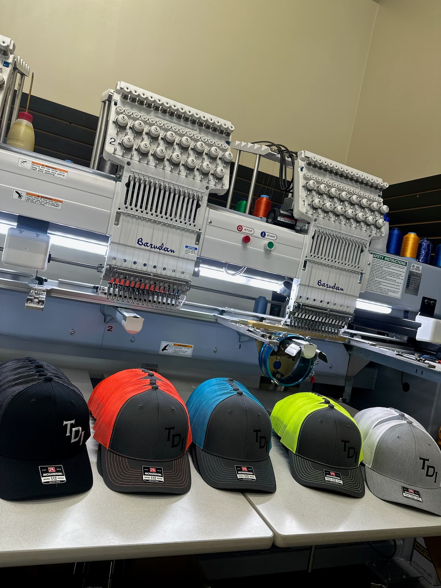 Multi-head embroidery machine running custom hats